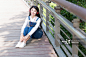 girl sitting on the bridge