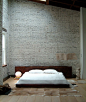 bedroom with brick walls