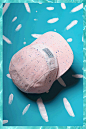 "Confetti" by Marta Veludo for Restored : This cap is the result of a unique collaboration between visual artist Marta Veludo and Restored. Veludo set out to design a cap that would embody the spirit of celebration. The outcome of experimentatio