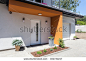 Bright space - a front door and a garage of a modern villa - stock photo