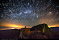 Star Trails above Simatai Great Wall - stock photo