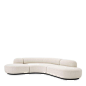 Eichholtz Bjorn Sofa - Ivory Bouclé : Enjoy the rich comfort and the striking boomerang-like design of Sofa Bjorn. Organic in shape and fully upholstered in cream-coloured bouclé, this sumptuous sofa matches with both modern and traditional interiors. It 