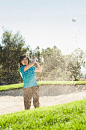 Korean woman hitting ball in sand trap on golf course by Gable Denims on 500px