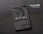 This is a high-end designer tag. It's got the original logo and style to it, although the minimal colours don't fit with the designer's clothing. This might be because black will stand out against the clothing.  The text has a 3D element to it, and the im