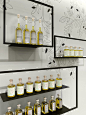 The purity and clarity of the oil is reflected in the minimalist store concept designed by Toronto-based Burdifilek, led by managing partner Paul Filek, and creative partner Diego Burdi. They are also responsible for retail design for W Hotels, Holt Renfr