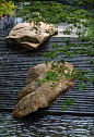 This may contain: two large rocks sitting on top of a grill