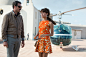 Alicia Vikander wears an orange print dress with a flared hemline as Gaby