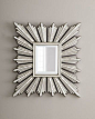 Silver-Leafed Sunburst Mirror $395     A small rectangular mirror resides inside the brilliant rays of this sunburst-framed mirror.  Handcrafted of resin and mirrored glass.  Hand-painted silver-leaf finish.  17"W x 1"D x 20"T.