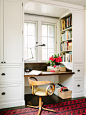 Example of an arts and crafts home office design with a built-in desk, white walls and dark hardwood floors