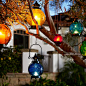 Pier 1's colorful handblown Medallion Glass Lanterns with embossed floral patterns make any outdoor gathering more festive.: 
