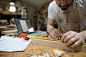 Carpenter measuring wood block in workshop by Hero Images on 500px