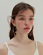 Fish shadow Earrings with Natural Pearl - Pink  Inspired by the unique curves of the sea, these stunning earrings feature a delicate golden frame that perfectly highlights the girliness and sweetness of the dainty pearl in pink.