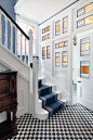 hall with harlequin floors and stained glass windows HAM interiors