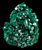 Dioptase crystals  From the Tsumeb Mine, Tsumeb, Namibia, SW Africa.  Measures 6.4 cm by 5.1 cm by 2.4 cm in total size.
