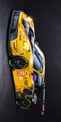 This may contain: an overhead view of a yellow race car with lights on it's headlight