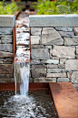 Stone and corten steel water rill and fountain