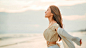 Happy young asian woman with freedom on the sea beach at golden sunset, Female tourist on seaside summer vacation. Happy young asian woman with freedom on the sea beach at golden sunset, Female tourist on seaside summer vacation.  outdoor standing beauty 