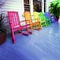 multiple rocking chairs in different hues. Love this...I won't be happy until my yard has more color than Disneyland!