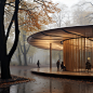 This may contain: people are standing outside in the rain near a circular structure that is surrounded by trees