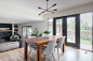 Great room - mid-sized 1960s laminate floor and brown floor great room idea in Calgary with white walls