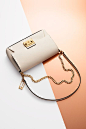 Chain attraction. Find perfect handbags for her, featuring the Galey saffiano leather clutch from Calvin Klein.