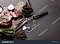 Grilled ribeye beef steak with red wine, herbs and spices on stone table