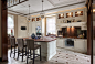 Transitional l-shaped gray floor kitchen photo in Moscow with a farmhouse sink, raised-panel cabinets, white cabinets, brown backsplash, stainless steel appliances and an island