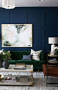 Stunning dark blue wall trimmed out with paneling in this formal sitting room // studio-mcgee.com