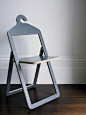 Hanger Chair by Philippe Malouin: Fold and use as a hanger. Unfold and have a seat.