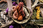 Hands holding basket of naturally dyed cotton