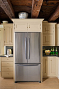 Tip: Place the fridge and flatware near the dining room and out of the cooking fray. | Refrigerator: @Kenmore | Photo: John Gruen