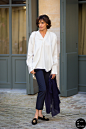 Haute Couture Fall 2014 Street Style: Ines de la Fressange : Ines de la Fressange, French model and fashion designer, before Schiaparelli couture show. Shop this look (or similar) here: Blouse: T by Alexander Wang Silk Wrap Blouse, Joie Marru Top or Joie 