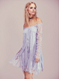 Free People Angel Lace Trapeze Mini Dress : Angel Lace Trapeze Mini Dress | Femme lace babydoll. Dramatic lace panels cascade from sheer ruched sleeves to complete the look. Bodice lined.