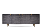 Oscillate Sideboard | Scala Luxury : This encasement of this sideboard is finished in a hand polished black lacquer The curved door fronts are mantled in a charcoal color raffia fabr