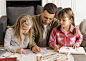 medium-shot-father-girls-drawing