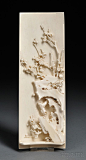 Ivory Wrist Rest, China, 19th century, rectangular, the interior carved with plum blossoms and rocks, lg. 9 in.
