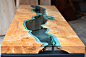 家具设计师Greg Klassen，以太平洋西北地区的地貌景观为灵感，设计了“桌上的河流”系列桌子。桌面上的曲线状玻璃用水刀切割后镶上桌面，将两块木质自然衔接或将树洞填充，值得一提的是所有的树木都源自可持续发展林，每一件纯手工制作的桌子，都是每一颗被丢弃的树木生命的延续。