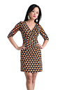 **Orange and Yellow Triangle Pattern Dress** Orange and Yellow dress with triangle pattern and three-quarter length sleeves.