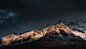 snow covered mountain under blue sky