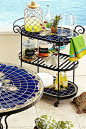 Pier 1's Rania Serving Cart does far more than serve. It gives you a hand—handcrafted, hand-painted, hand-forged, hand-set ceramic tiles and hand-adjustable casters. With its vibrant colors, global-inspired design and three shelves, it's a great way to ma