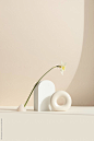 White shapers arranged in a soft light by Ellie Baygulov for Stocksy United