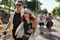 woman and man walking on park during daytime