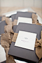 Find beauty with burlap — ceremony programs with rustic details.