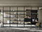 Hector : Molteni Hector bookcase in black oak finish, . Design by Vincent Van Duysen. Composed by 4 wall mounting uprights height 3150mm, 11 shelfs 831mm and depth 350mm, 2x cases 831x350x460mm. Thanks to the different sizes of the shelves and the mo