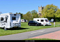 Modern motorhomes and caravans on the Tewkesbury Abbey Caravan and Motorhome Club Site. Stock Photo