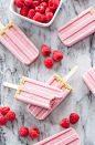 Raspberry Cheesecake Yogurt Popsicles | These popsicles are the perfect healthy treat to cool off with on a hot day!