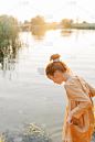 Curly caucasian girl wearing natural linen dress s