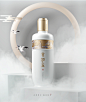 a white bottle with chinese writing on it and two birds flying in the sky behind it