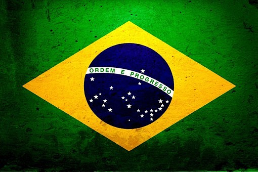 巴西国旗旗底为绿色，中间是一个黄色菱形，...