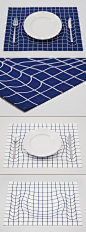 Japanese design studio A.P.Works playfully mimics the imagery of Albert Einstein's space-time fabric theory with this mind-bending placemat. By warping the grid pattern, the trick mat creates the illusion that the plate and silverware are weighing down th